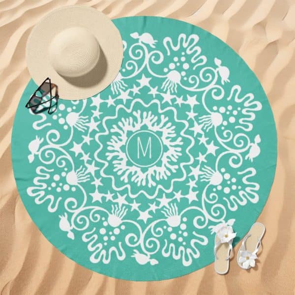 Teal Round Beach Towel With A White Mandala Design And A Central Monogram.