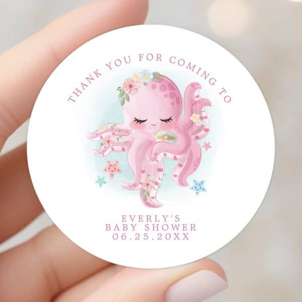 Round Baby Shower Thank You Sticker Featuring A Pink Octopus Adorned With Flowers.