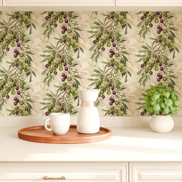 Kitchen Counter With A Coffee Pot And Mug On A Wooden Tray In Front Of A Backsplash Featuring A Watercolor Olive Branch Pattern.
