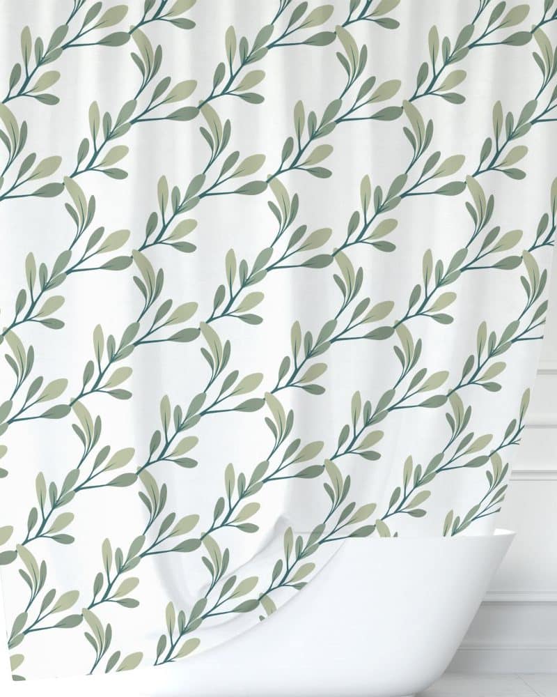 Shower curtain with a repeating pattern of green leaves on a white background.