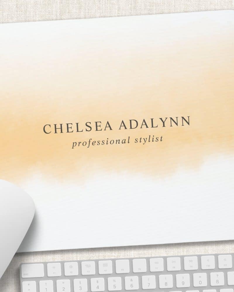 Mousepad with a peach watercolor design and Chelsea Adalynn professional stylist text.