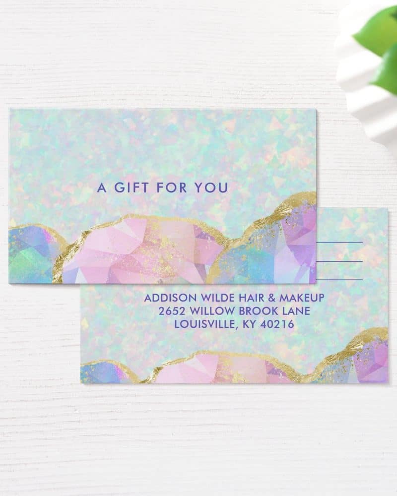 Pastel gift certificate with gold accents and business address.