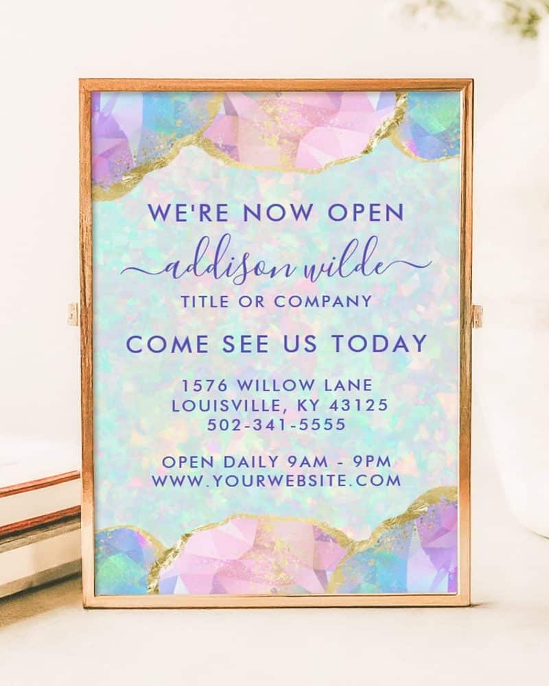 Grand opening announcement for Addison Wilde, featuring pastel gemstone design. Includes address, phone number, and website.