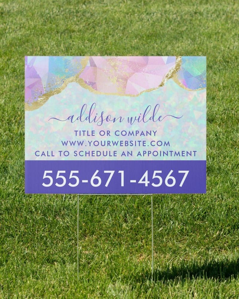 Yard sign with pastel geometric design, Addison Wilde's name, website, and phone number.