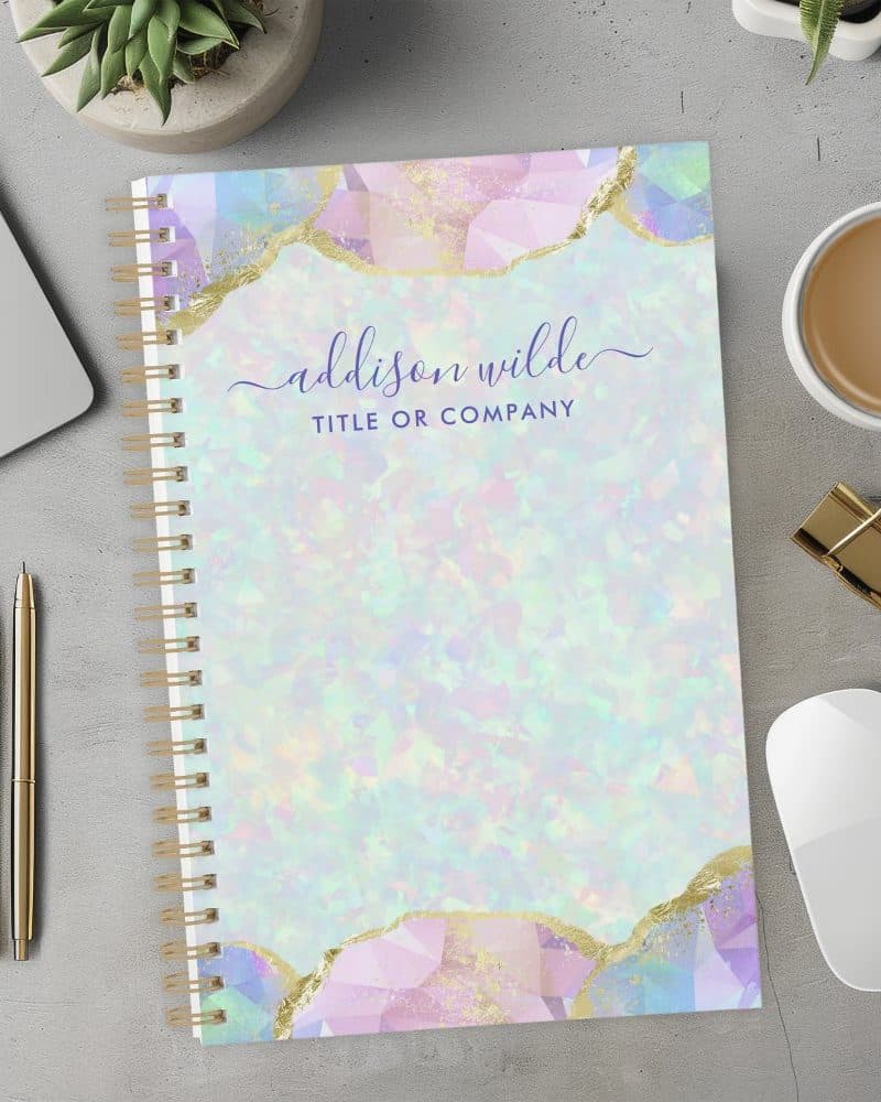 Spiral-bound notebook with pastel opal design and gold accents; personalized with a name and title.