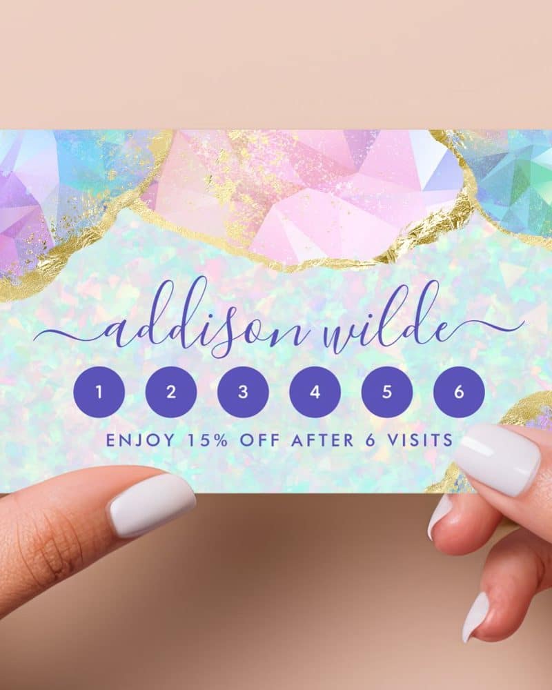 Pastel pink and blue loyalty card for Addison Wilde with six circles to punch and a 15% off reward after six visits.
