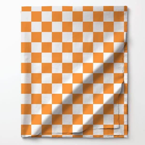 Orange And White Checkered Fabric Folded On A White Background.