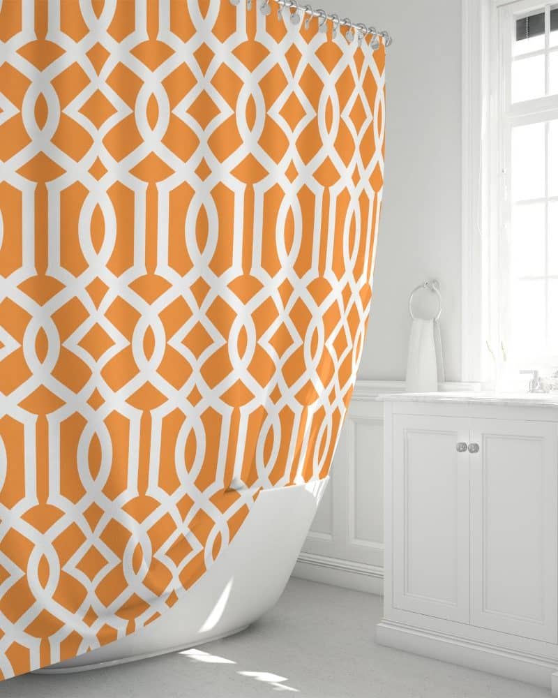 Orange and white geometric patterned shower curtain.