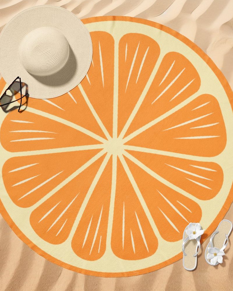 Round beach towel depicting a stylized orange slice.