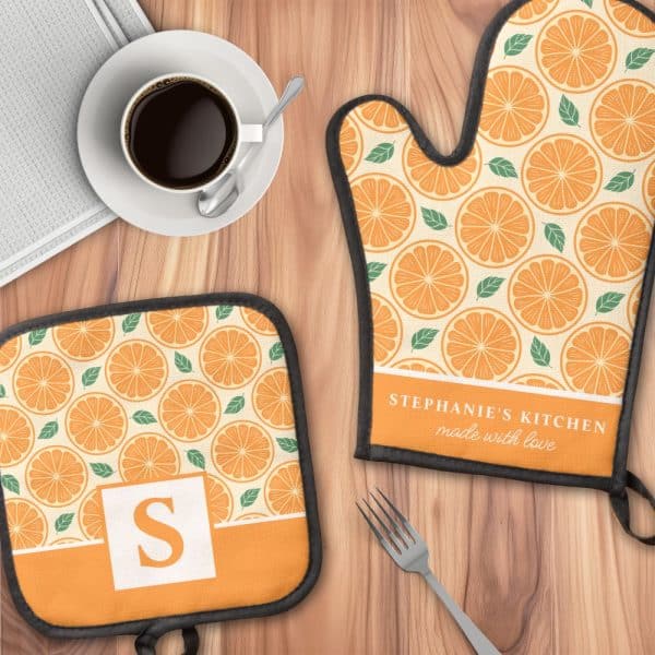 Personalized Oven Mitt And Pot Holder With An Orange Slice Pattern. The Oven Mitt Is Labeled &Quot;Stephanie'S Kitchen, Made With Love&Quot;.