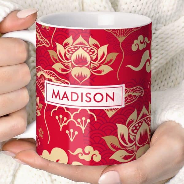 Red Mug With Gold Lotus Flower Design And The Name Madison.