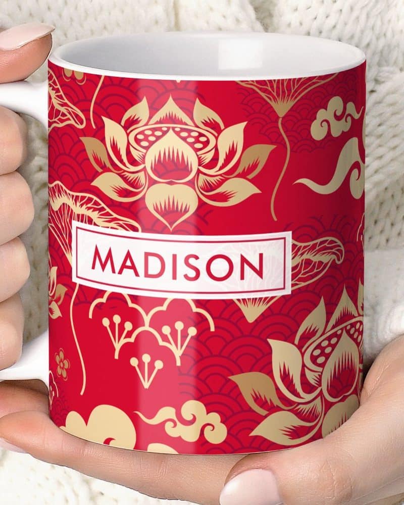 Red mug with gold lotus flower design and the name Madison.