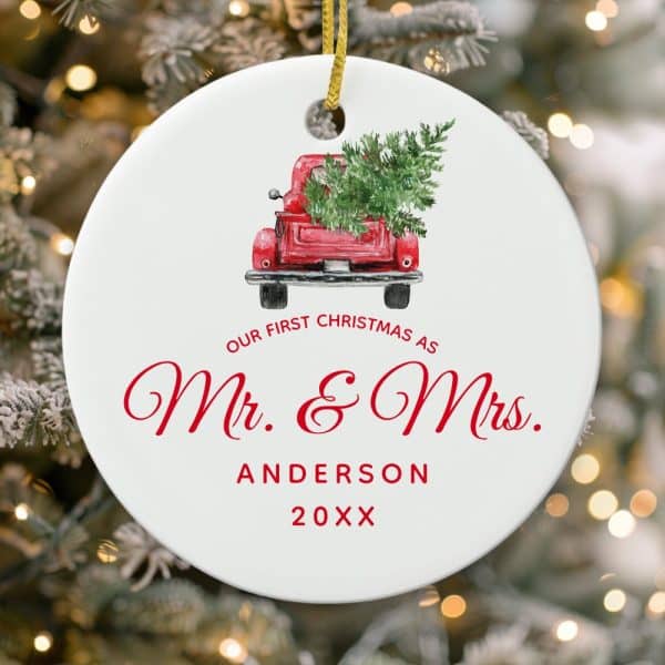 Round Christmas Ornament Showing A Red Truck Carrying A Christmas Tree. Text Reads Our First Christmas As Mr. &Amp; Mrs. Anderson 20Xx.
