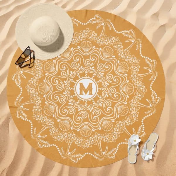 Mustard Yellow Round Beach Towel With A White Mandala Design And A Central Monogrammed M.