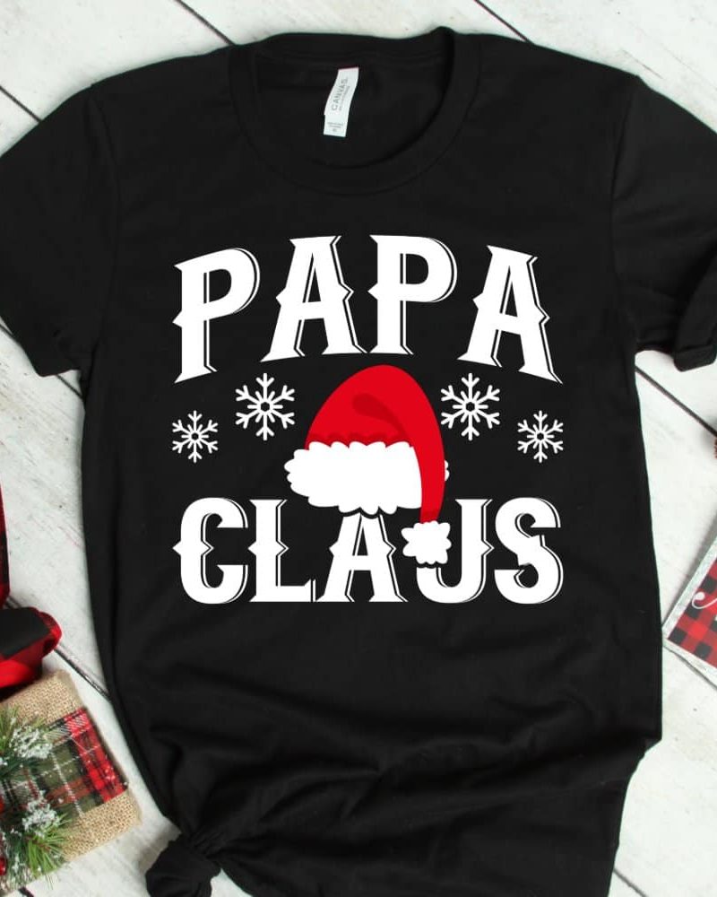 Black t-shirt with Papa Claus design featuring a Santa hat and snowflakes.