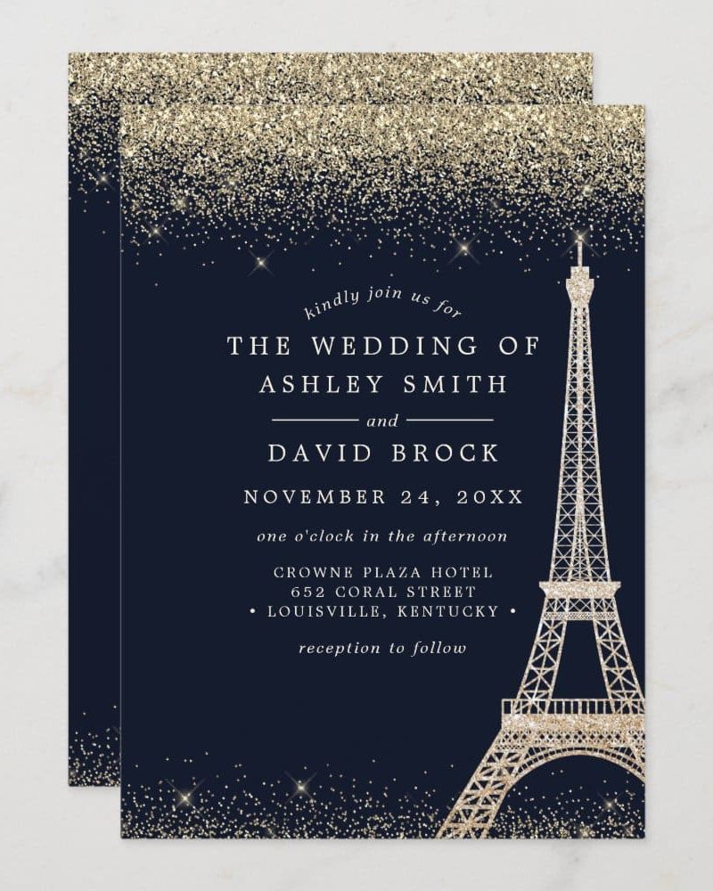 Wedding invitation with a gold glitter design and Eiffel Tower graphic.