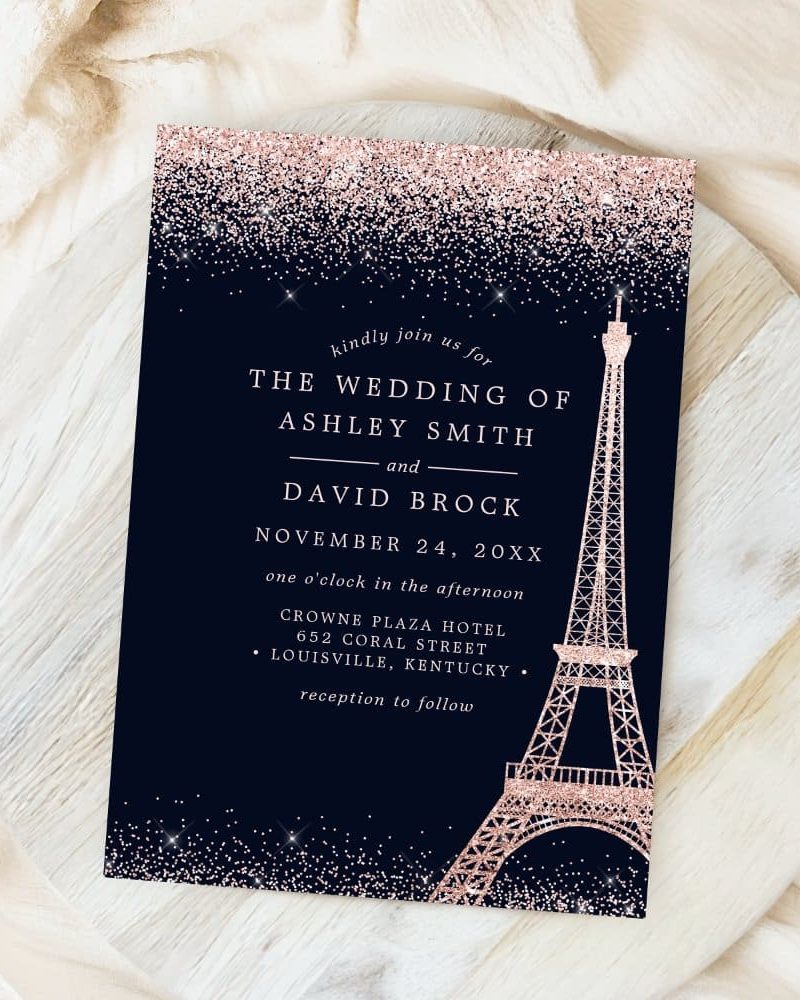 Rose gold glitter wedding invitation with Eiffel Tower.