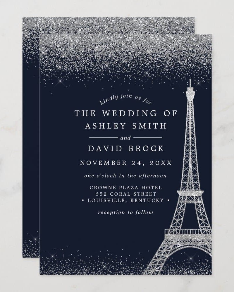 Silver glitter wedding invitation featuring the Eiffel Tower, announcing the wedding of Ashley Smith and David Brock.