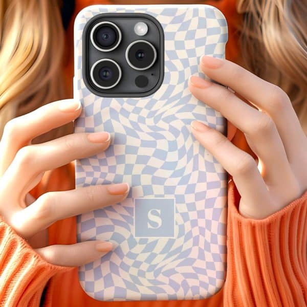 A Person Holding A Light Blue And White Checkered Phone Case With A Letter S In The Center.