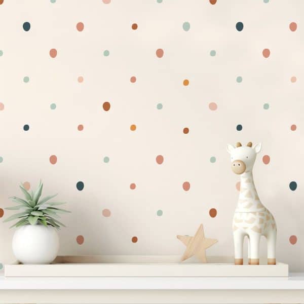 A Shelf With A Small Potted Plant, A Wooden Star, And A Giraffe Figurine Against A Wall With Multicolored Polka Dots.