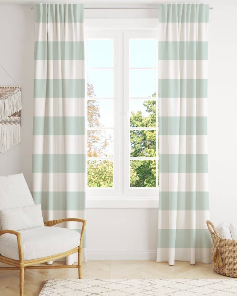 Light green and white striped curtains hang in front of a window.