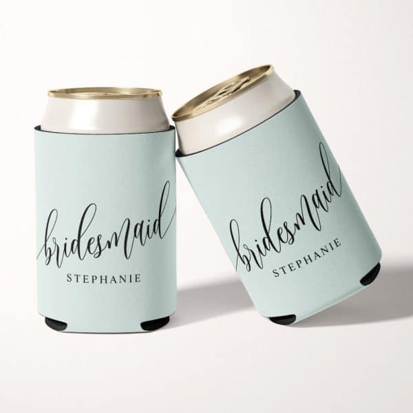 Two Light Teal Can Coolers With The Word Bridesmaid And The Name Stephanie In Black Script.