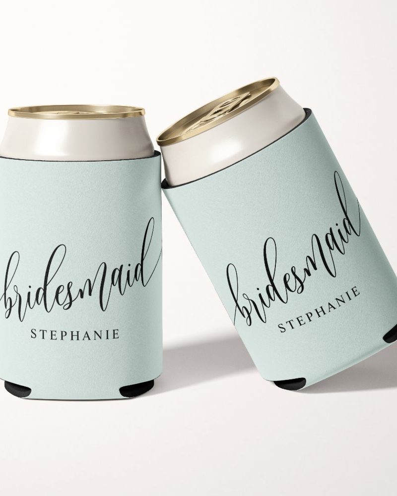 Two light teal can coolers with the word Bridesmaid and the name Stephanie in black script.