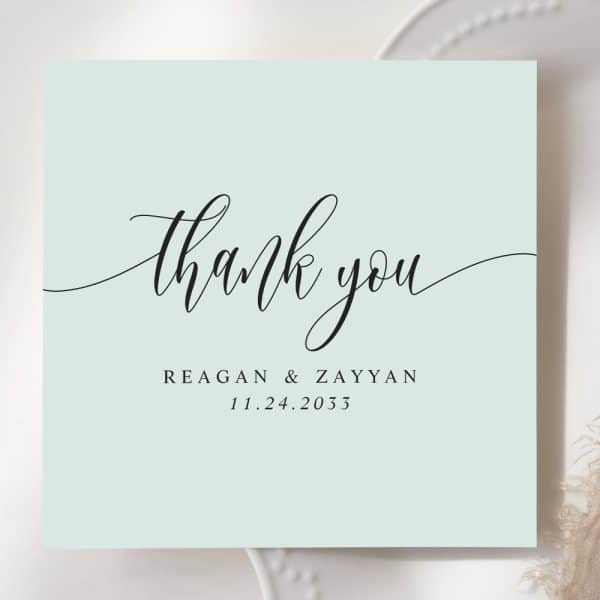 Light Blue Thank You Card With Elegant Script Lettering. The Names Reagan &Amp; Zayyan And The Date 11.24.2033 Are Also Included.
