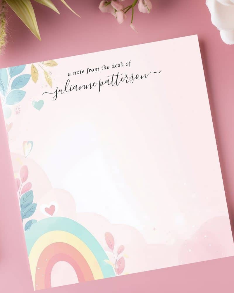Pink stationery featuring a pastel rainbow and floral design with Julianne Patterson's name.
