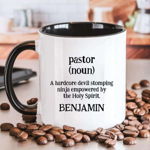 White Coffee Mug With Black Handle And Interior, Displaying A Humorous Definition Of Pastor, Personalized With The Name Benjamin.