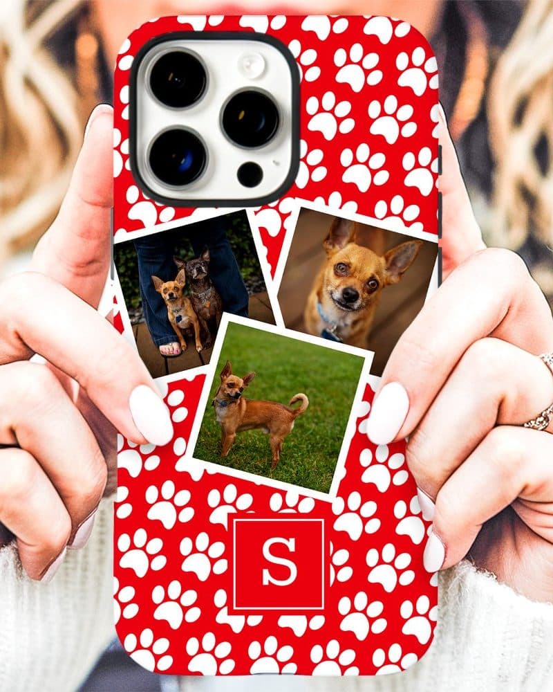 A red phone case with white paw prints, featuring multiple photos of small dogs and a monogrammed initial S, held by a person.