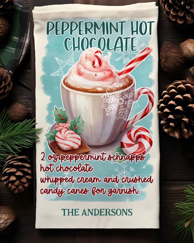 Tea towel design featuring a mug of peppermint hot chocolate topped with whipped cream and candy canes.