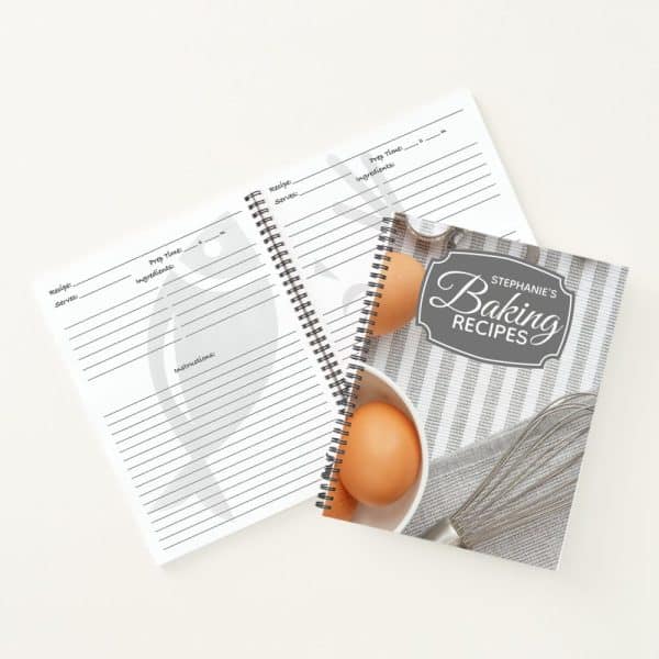 A Spiral-Bound Baking Recipe Book With Blank Recipe Pages And A Cover Featuring Eggs And A Whisk.