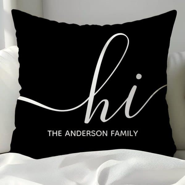 Black Pillow With White Cursive &Quot;Hi&Quot; And &Quot;The Anderson Family&Quot; Below.
