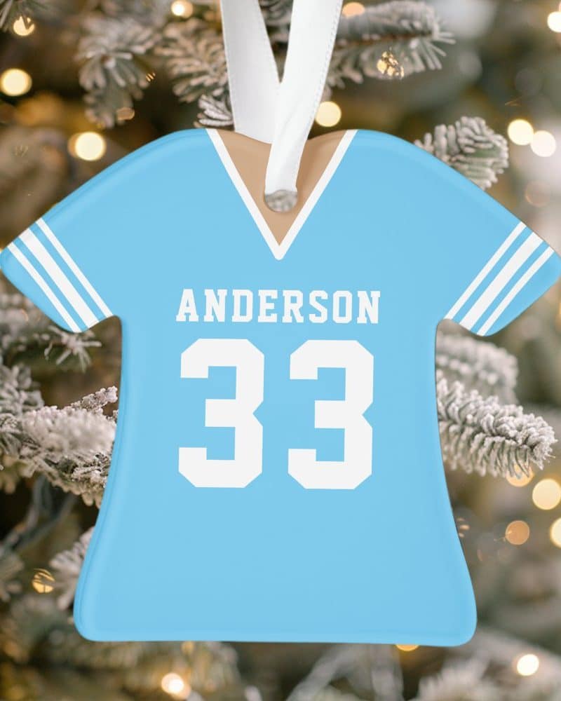 Light blue personalized jersey Christmas ornament with the name Anderson and number 33.