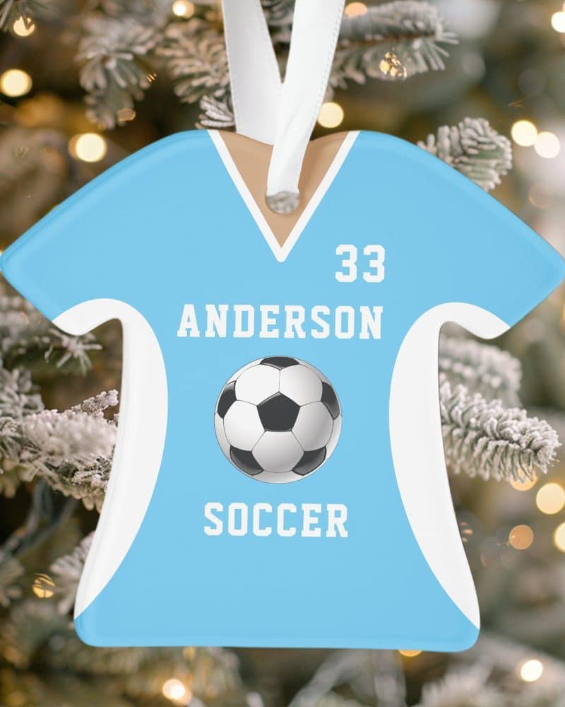 Light blue soccer jersey ornament with the name Anderson and number 33. A soccer ball is centered below the name.