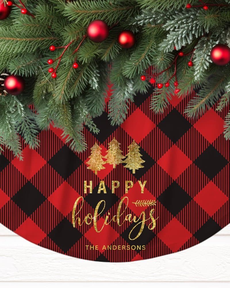 Red and black buffalo plaid Christmas tree skirt with gold lettering that says Happy Holidays and The Andersons.