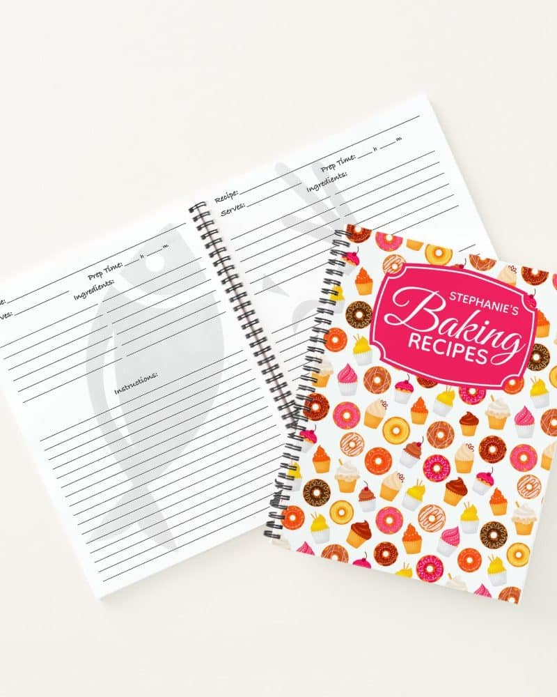Spiral-bound baking recipe book with a colorful cupcake and donut cover.