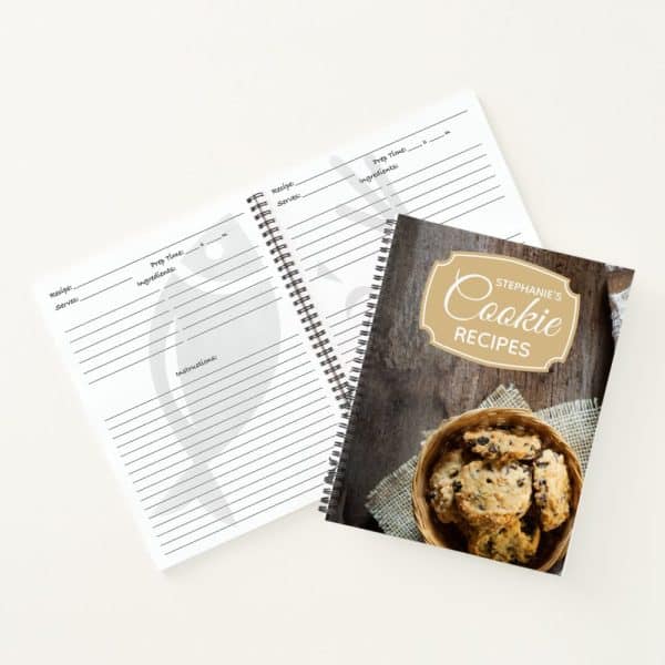Spiral-Bound Blank Recipe Book Next To A Spiral-Bound Cookie Recipe Book With A Photo Of Chocolate Chip Cookies.