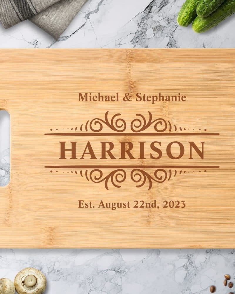 Personalized bamboo cutting board with the names Michael & Stephanie Harrison and established date August 22nd, 2023.