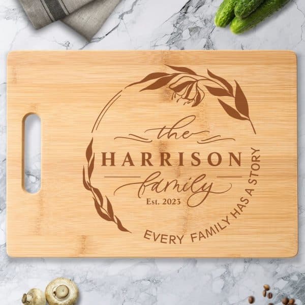 Personalized Bamboo Cutting Board With The Harrison Family Name, Established Date 2023, And A Floral Design.