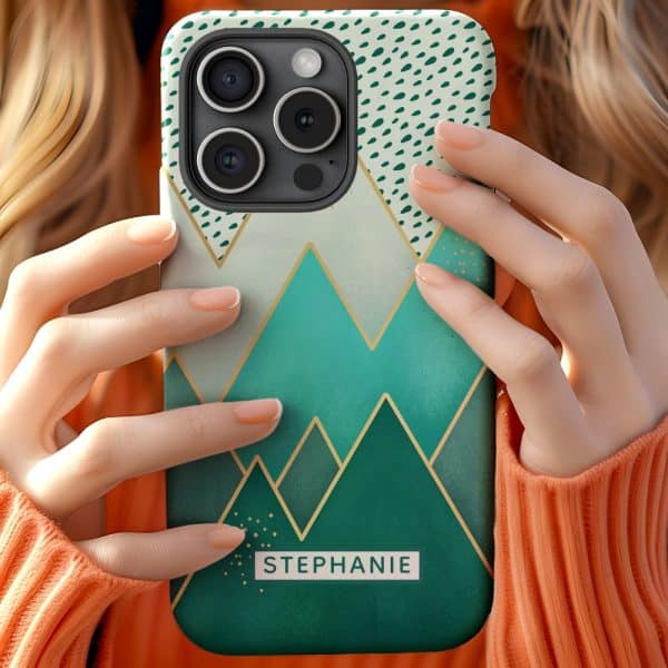 Close-Up Of Hands Holding A Teal And Gold Iphone Case Featuring A Geometric Mountain Design And The Name Stephanie.