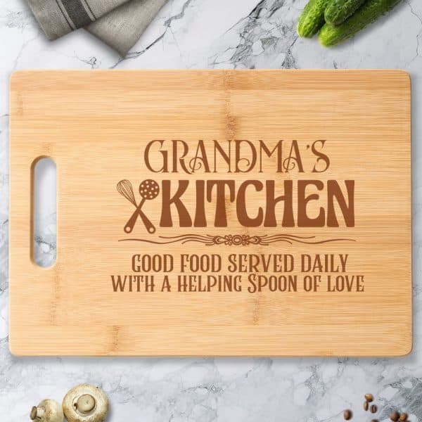 Bamboo Cutting Board With The Engraved Text Grandmas Kitchen, Good Food Served Daily With A Helping Spoon Of Love.