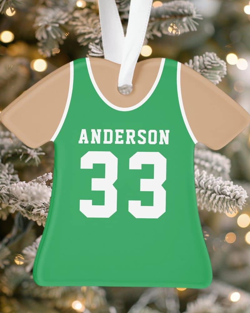 Green and tan basketball jersey ornament with the name Anderson and number 33.