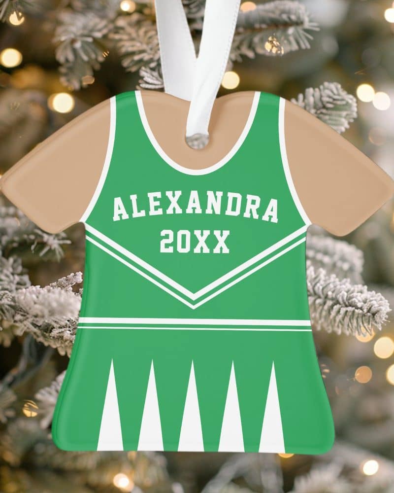 Green cheerleader uniform Christmas ornament with the name Alexandra and year 20XX.