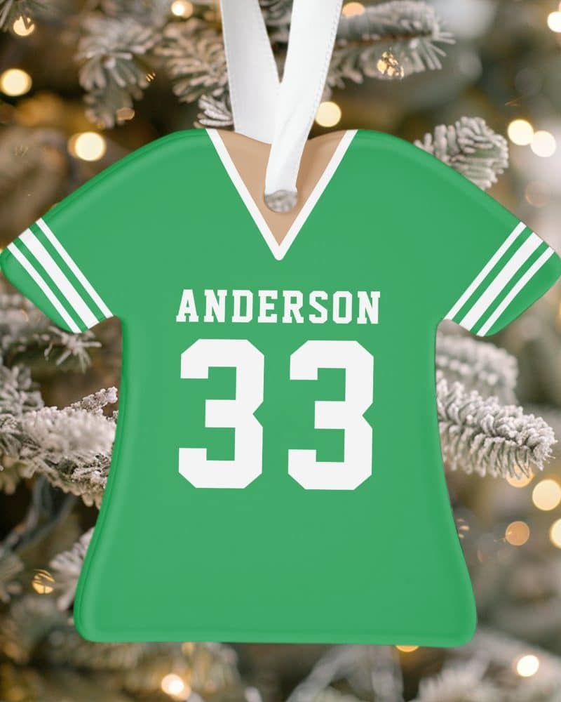 Green jersey-shaped Christmas ornament with the name Anderson and number 33.