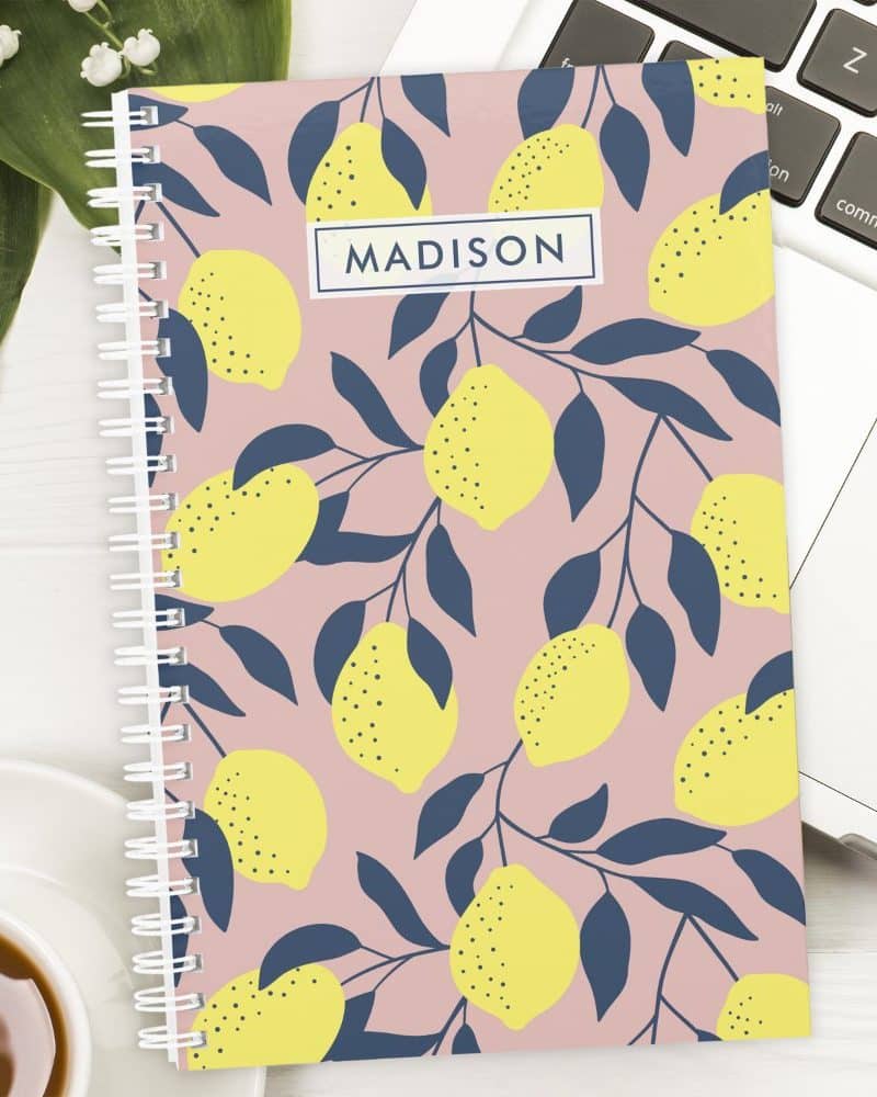 Pink spiral notebook with a lemon pattern and the name Madison on the cover.
