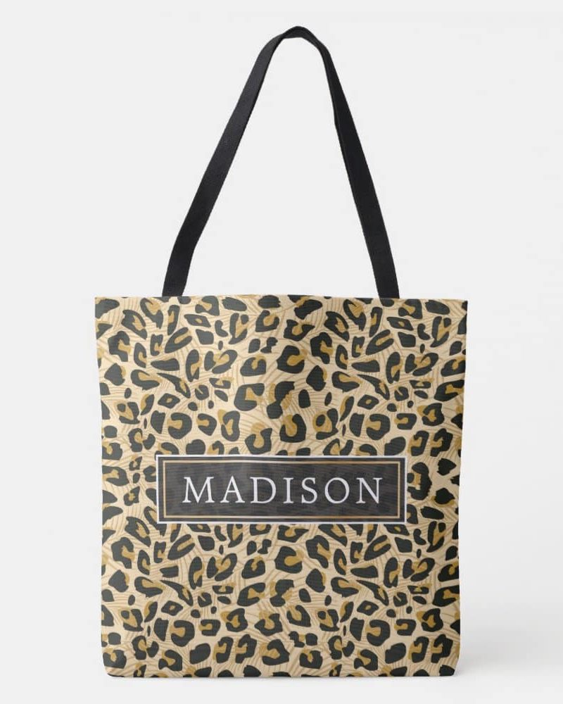 Beige tote bag with black and gold leopard print and the name Madison in a black rectangle.