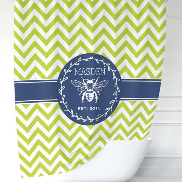 Lime Green Chevron Shower Curtain With A Navy Blue Circular Logo Featuring A Bee And The Name Madsen.