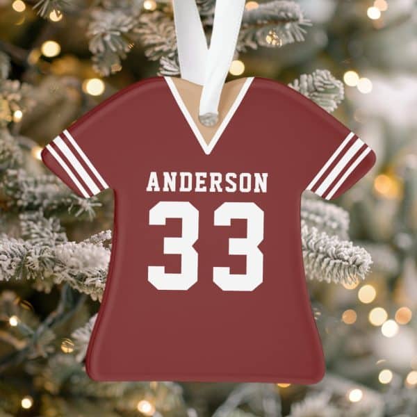 A Maroon Football Jersey Ornament With The Name Anderson And Number 33.